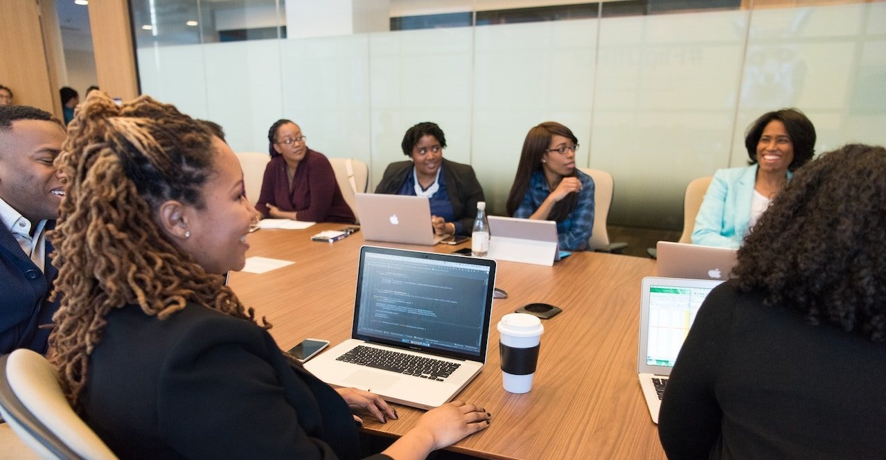 SEO Digital Marketing Team Sitting In Office